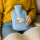 Fashy Wärmflasche für Kinder Kuh Motiv mit Fleecebezug blau